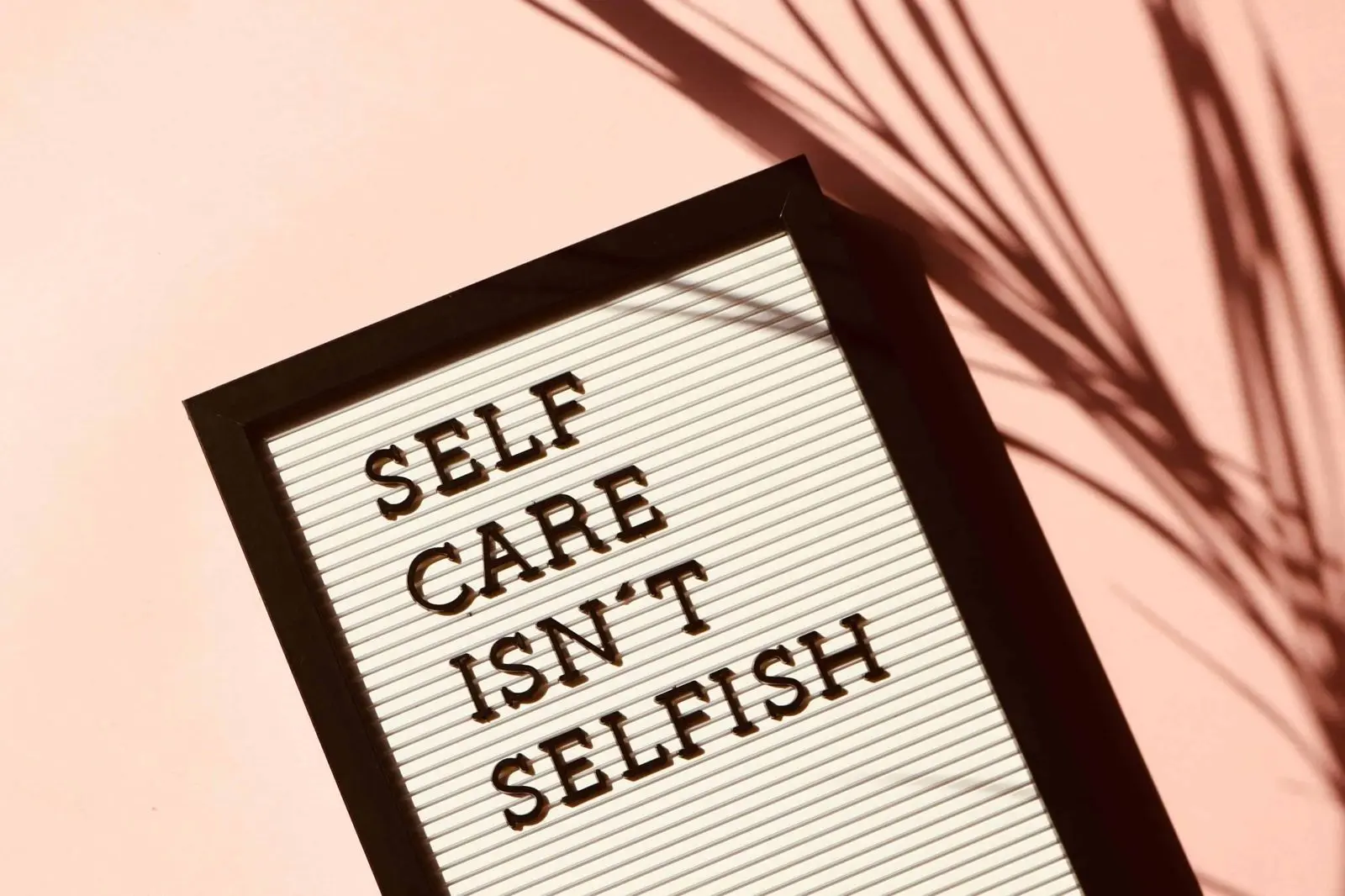 Letter board reading Self care isn’t selfish